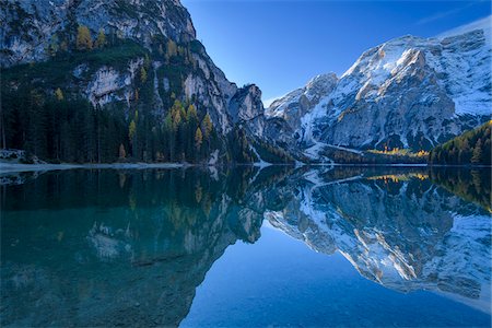 simsearch:600-08082937,k - Croda del Becco (Seekofel) reflected in the calm waters of Braies Lake in autumn, Prags Dolomites, South Tyrol, (Bozen Province) Trentino Alto Adige, Italy Stock Photo - Premium Royalty-Free, Code: 600-08916136