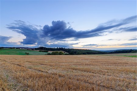 simsearch:600-08973340,k - Harvested cereal field at dusk in summer at Roellbach in the Spessart hills in Bavaria, Germany Stock Photo - Premium Royalty-Free, Code: 600-08973332