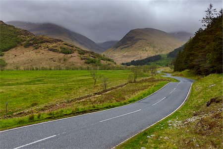 simsearch:700-02082042,k - Winding country road and hills with overcast sky at Glen Nevis near Fort William in Scotland, United Kingdom Stock Photo - Premium Royalty-Free, Code: 600-08973424