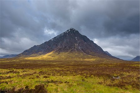 simsearch:600-06847380,k - Mountain range Buachaille Etive Mor with dark cloudy sky at Glen Coe in Scotland, United Kingdom Stock Photo - Premium Royalty-Free, Code: 600-08973444