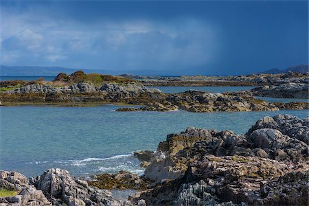 simsearch:600-05803652,k - Scottish coast with rocky shoreline and storm clouds in the distance in spring at the port of Mallaig in Scotland, United Kingdom Stock Photo - Premium Royalty-Free, Code: 600-08973465