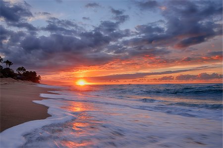 simsearch:400-07091395,k - Sunset and surf on the Pacific Ocean at Sunset Beach on Oahu, Hawaii, USA Foto de stock - Sin royalties Premium, Código: 600-08986240