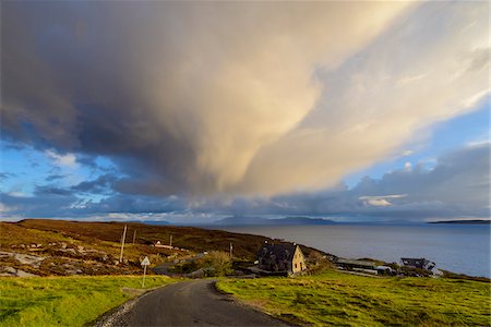 simsearch:6118-08399715,k - Road leading to the harbor with houses on the hillside and storm clouds over Loch Scavaig on the Isle of Skye in Scotland, United Kingdom Stock Photo - Premium Royalty-Free, Code: 600-08986279