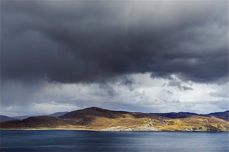 simsearch:6118-08399715,k - Scottish coast with rainclouds over the Isle of Skye in Scotland, United Kingdom Stock Photo - Premium Royalty-Free, Code: 600-08986286