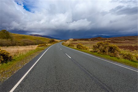 simsearch:6118-08399701,k - Country road with dramatic clouds in springtime on the Isle of Skye in Scotland, United Kingdom Stock Photo - Premium Royalty-Free, Code: 600-08986287