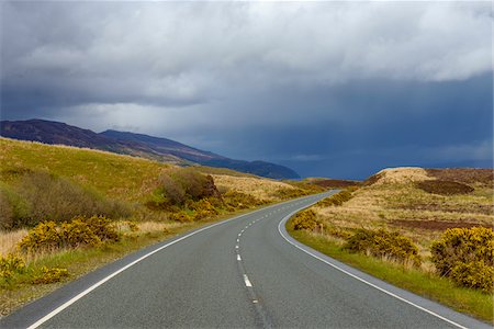 simsearch:6118-08399701,k - Winding country road with rainclouds in springtime on the Isle of Skye in Scotland, United Kingdom Stock Photo - Premium Royalty-Free, Code: 600-08986289