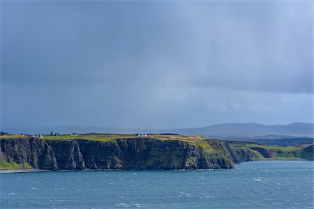 simsearch:6118-08399715,k - Sunlit sea cliffs and rainclouds along the coast of the Isle of Skye in Scotland, United Kingdom Stock Photo - Premium Royalty-Free, Code: 600-08986458