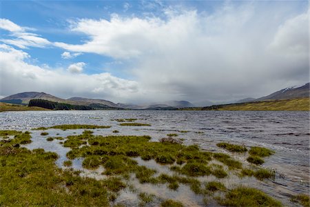 simsearch:6118-08399715,k - Grassy shoreline and dramatic cloud formations at Loch Tulla near Glen Coe in Scotland, United Kingdom Stock Photo - Premium Royalty-Free, Code: 600-08986501