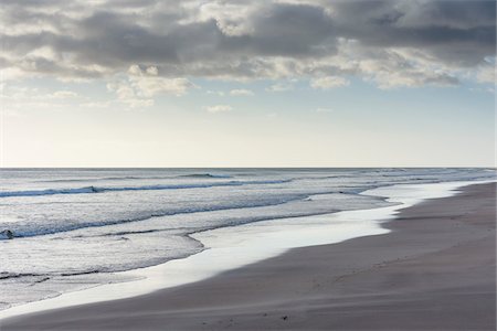 simsearch:600-05524186,k - Surf of the North Sea along the beach at Bamburgh in morning light in Northumberland, England, United Kingdom Stock Photo - Premium Royalty-Free, Code: 600-09013910