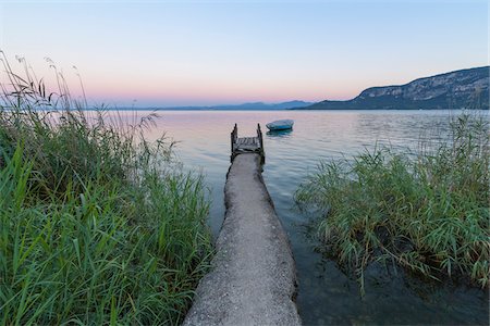 symmetrical - Angler jetty on Lake Garda (Lago di Garda) at dawn in Garda in Veneto, Italy Stock Photo - Premium Royalty-Free, Code: 600-09022400