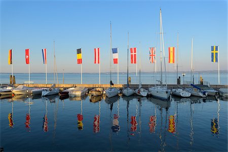 simsearch:649-07520952,k - Row of boats and colorful European flags in the harbor marina on Lake Garda (Lago di Garda) at Bardolino in Veneto, Italy Stock Photo - Premium Royalty-Free, Code: 600-09022431