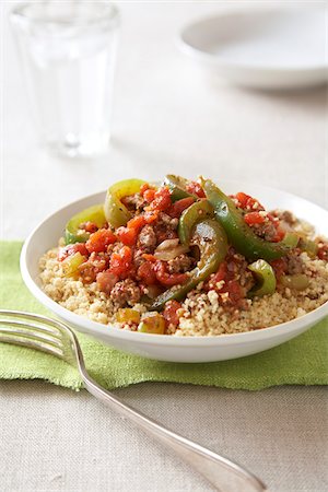 simsearch:600-06892689,k - Spicy ground beef with peppers and couscous  on a green napkin with a fork Stock Photo - Premium Royalty-Free, Code: 600-09119337