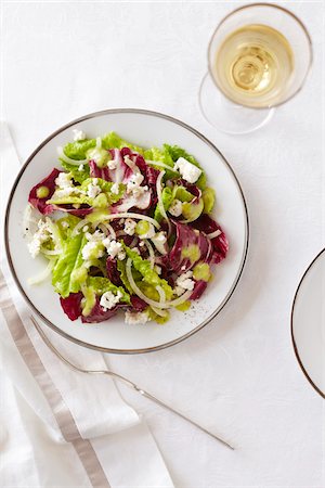 simsearch:600-02912202,k - Romaine and endive salad with a glass of white wine Stock Photo - Premium Royalty-Free, Code: 600-09119400