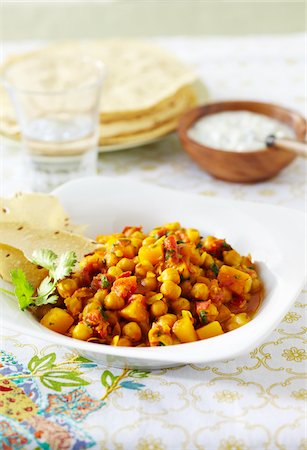simsearch:600-06892689,k - Bowl of chickpea curry with papadum and raita Stock Photo - Premium Royalty-Free, Code: 600-09155461