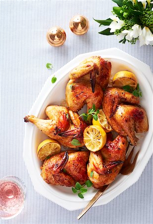 simsearch:600-06382994,k - Platter of roasted cornish hens with lemon and herbs Stock Photo - Premium Royalty-Free, Code: 600-09155538
