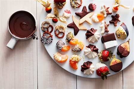 simsearch:600-07311268,k - Cookies and sweets dipped in melted chocolate on a platter Stock Photo - Premium Royalty-Free, Code: 600-09159780
