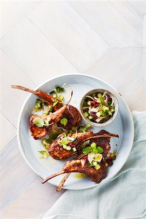 simsearch:600-07311268,k - Lamb chops with cucumber mint salsa on serving tray Stock Photo - Premium Royalty-Free, Code: 600-09159792