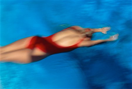 simsearch:700-00091923,k - Blurred View of Woman in Swimwear Diving into Swimming Pool Stock Photo - Premium Royalty-Free, Code: 600-00022179
