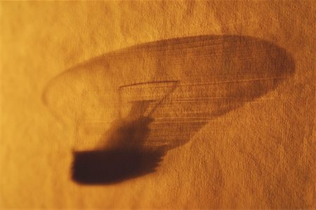 simsearch:640-01362739,k - Shadow of Lightbulb on Textured Surface Stock Photo - Premium Royalty-Free, Code: 600-00058408