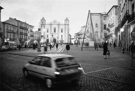 Car Driving on Street near Buildings, Evora, Portugal Stock Photo - Premium Royalty-Free, Code: 600-00062770