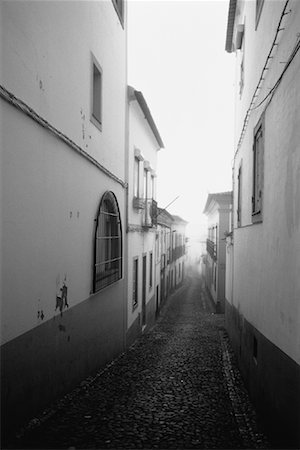 Buildings along Narrow Street, Evora, Portugal Stock Photo - Premium Royalty-Free, Code: 600-00062870