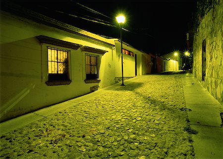 empty mexican street - Buildings and Cobblestone Street At Night, Oaxace, Mexico Stock Photo - Premium Royalty-Free, Code: 600-00063456