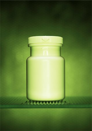 Close-Up of Pill Bottle on Shelf Stock Photo - Premium Royalty-Free, Code: 600-00078183