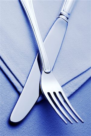 set (pair or group of things) - Knife and Fork on Place Setting Stock Photo - Premium Royalty-Free, Code: 600-00084054