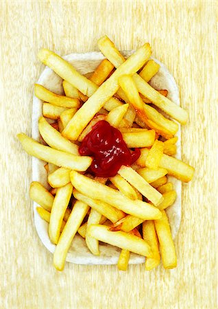 French Fries With Ketchup Stock Photo - Premium Royalty-Free, Code: 600-00477233