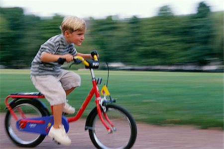 panning (camera technique) - Boy Riding Bicycle Stock Photo - Premium Royalty-Free, Code: 600-00795664