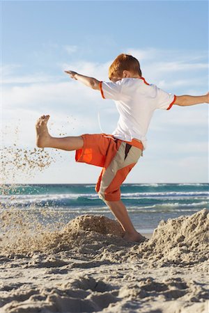 simsearch:700-01042880,k - Boy Kicking Sandcastles Stock Photo - Premium Royalty-Free, Code: 600-00796447