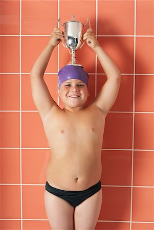 Portrait of Boy Holding Trophy Stock Photo - Premium Royalty-Free, Code: 600-00814697