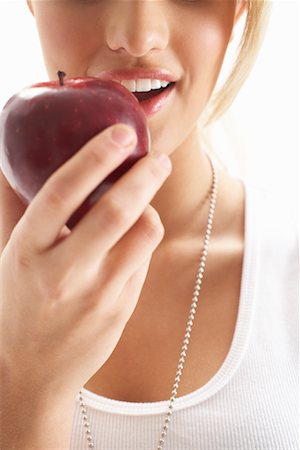 Girl Eating Apple Stock Photo - Premium Royalty-Free, Code: 600-00824023