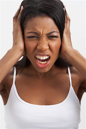 simsearch:600-00823976,k - Woman Covering Ears Stock Photo - Premium Royalty-Free, Code: 600-00823889