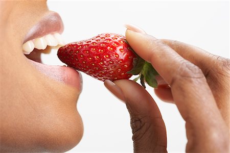 simsearch:873-06440787,k - Woman Eating Strawberry Stock Photo - Premium Royalty-Free, Code: 600-00823909