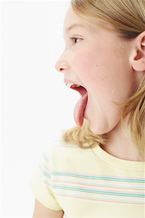 Girl Sticking Tongue Out Stock Photo - Premium Royalty-Free, Code: 600-00846353