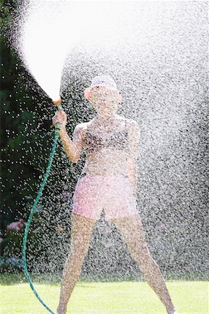 simsearch:600-00847728,k - Women Spraying Water With Hose Stock Photo - Premium Royalty-Free, Code: 600-00847730