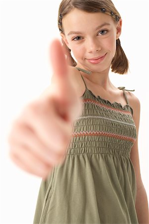 simsearch:600-00847925,k - Girl Giving Thumbs Up Stock Photo - Premium Royalty-Free, Code: 600-00847943