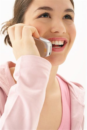 simsearch:600-03244230,k - Girl Using Cellular Phone Stock Photo - Premium Royalty-Free, Code: 600-00847974