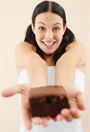 simsearch:600-02033679,k - Woman Holding Piece of Cake Stock Photo - Premium Royalty-Free, Code: 600-00848085
