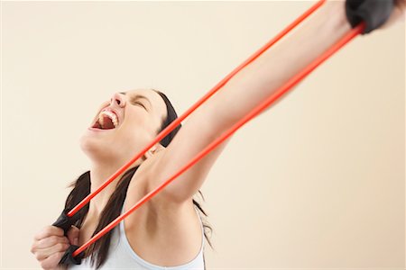 stretching (extended object) - Woman With Exercise Band Stock Photo - Premium Royalty-Free, Code: 600-00848080