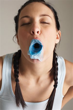 Woman Blowing Bubble Gum Bubbles Stock Photo - Premium Royalty-Free, Code: 600-00848094