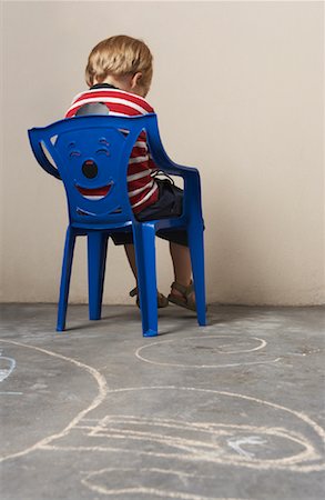 sulky tantrum - Boy Sitting in Chair Stock Photo - Premium Royalty-Free, Code: 600-00848643