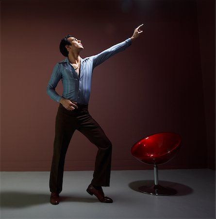 disco style man - Man Dancing, Wearing Vintage Clothing Stock Photo - Premium Royalty-Free, Code: 600-00848726