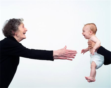 elderly poses - Woman Reaching for Grandchild Stock Photo - Premium Royalty-Free, Code: 600-00864440