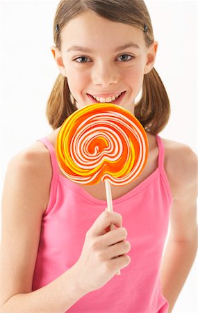 Girl Holding large Lollipop Stock Photo - Premium Royalty-Free, Code: 600-00866056