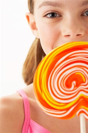 Girl Holding large Lollipop Stock Photo - Premium Royalty-Free, Code: 600-00866057