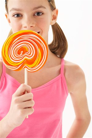 Girl Holding large Lollipop Stock Photo - Premium Royalty-Free, Code: 600-00866058
