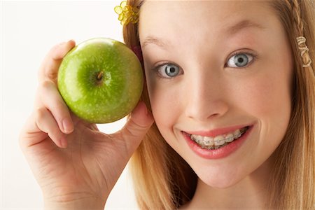 simsearch:600-00866237,k - Girl Holding Apple Stock Photo - Premium Royalty-Free, Code: 600-00866099