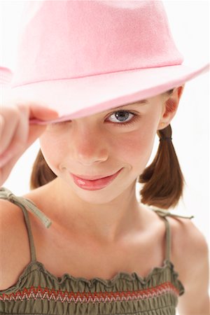 simsearch:600-00847925,k - Girl Tipping Hat Stock Photo - Premium Royalty-Free, Code: 600-00866129